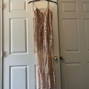 Gorgeous showpo champagne colored sequence prom dress. With long slit
